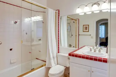 a bathroom with a sink and a shower and a toilet at Lake Arrowhead Home with 3 Decks and Stunning Views! in Lake Arrowhead