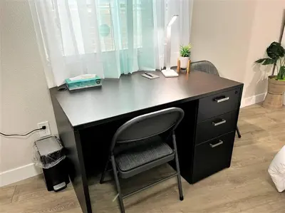 a black desk with a chair in a room at LA Home - FIFA Soccer, NBA Games, Universal Studios in Los Angeles