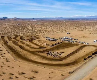 an aerial view of a dirt road in the desert at Beysicair Tents & Campground in California City