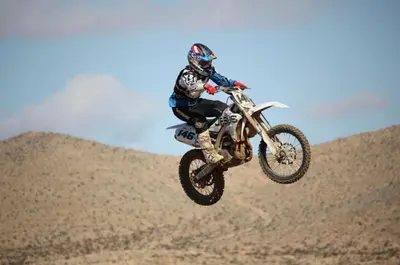a person jumping a dirt bike in the air at Beysicair Tents & Campground in California City