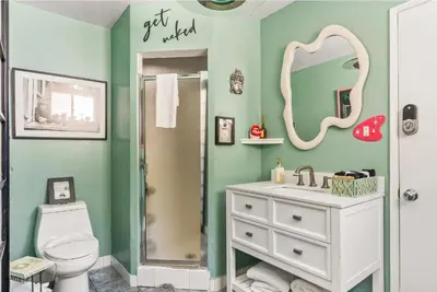 a bathroom with a white sink and a mirror at The Malibu Retreat Guest House - Salt Water Pool & Jacuzzi, Nature Oasis in Calabasas
