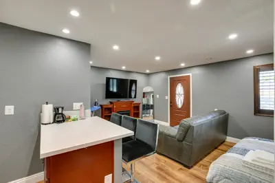 a living room with two chairs and a table and a couch at Hidden Gem in Hawthorne about 3 Mi to SoFi Stadium in Hawthorne