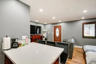 a living room with a white table and chairs at Hidden Gem in Hawthorne about 3 Mi to SoFi Stadium in Hawthorne