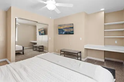 a bedroom with a bed and a ceiling fan at Paramount Paradise in Big Bear Lake