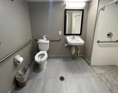 a bathroom with a toilet and a sink at Studio 6 Suites Carson, CA in Carson