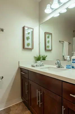 a bathroom with a sink and a large mirror at Lovely and cozy apartment- Rancho in Rancho Palos Verdes