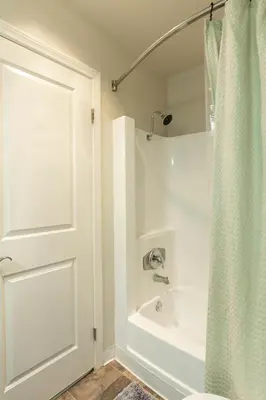 a bathroom with a shower and a white tub at Lovely and cozy apartment- Rancho in Rancho Palos Verdes