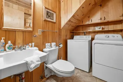 a bathroom with a toilet and a sink at Kapers - Located in a beautiful quiet area of Big Bear Lake, walking distance to Snow Summit! in Big Bear Lake