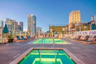 a pool on the roof of a building at Stunning 1 BDR 1 BTH Modern Loft with Pool, Jacuzzi in DTLA! in Los Angeles
