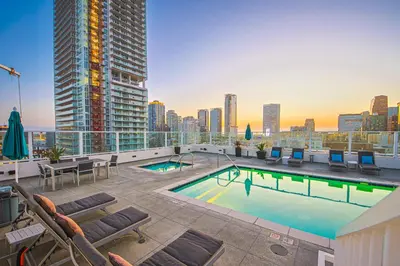 a swimming pool on the roof of a building at Stunning 1 BDR 1 BTH Modern Loft with Pool, Jacuzzi in DTLA! in Los Angeles
