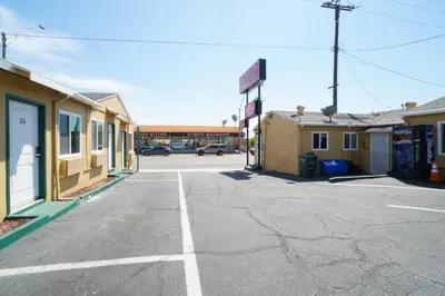 an empty parking lot in a small town at SIGNAL HILL MOTEL BEACH MOTEL in Long Beach