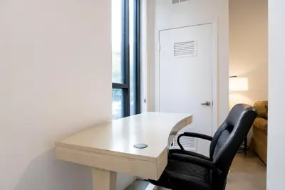 a desk and a chair in a room with a window at Cozy Huge LOFT for Live and Work in Los Angeles