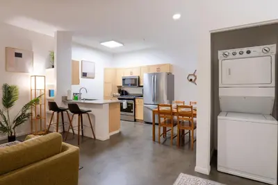 a living room with a kitchen and a dining room at Huge luxury loft for enjoying in Los Angeles