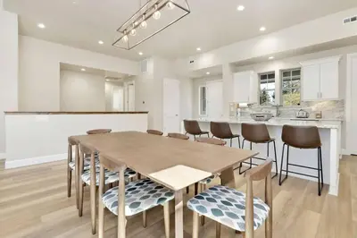 a kitchen with a wooden table and chairs at The Pines Retreat- Impeccable Modern Village Chalet in Big Bear Lake