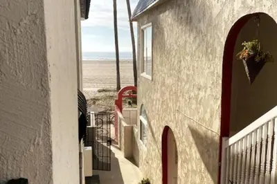 a building with a view of the beach from the street at House on The Beach in Los Angeles