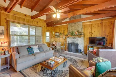 a living room with a couch and a fireplace at Crestline Cabin Close to Lake Arrowhead and Skiing in Crestline