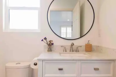 a bathroom with a sink and a mirror at The Cozy Oasis - A Renovated and Modern Studio near LAX + SoFi + Beaches + Freeway in Lawndale