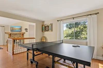 a living room with a ping pong table in it at Charming Getaway Cabin in Lake Arrowhead