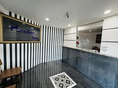 a restaurant with a black and white stripped wall at Paradise Inn-Montebello,Los Angeles in Montebello