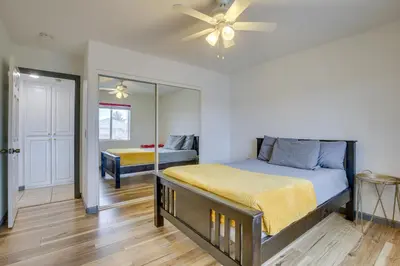 a bedroom with a bed and a ceiling fan at Family Helendale Home - Private Dock and Fire Pit! in Helendale
