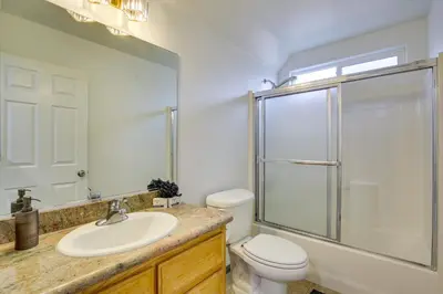 a bathroom with a toilet and a sink and a shower at Family Helendale Home - Private Dock and Fire Pit! in Helendale