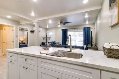 a kitchen with a sink and a counter at Fast WiFi and Free Parking Cozy Fontana Apartment in Fontana