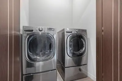 two washing machines sitting next to each other in a room at Coldwater Canyon in Los Angeles