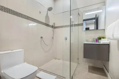 a bathroom with a toilet and a glass shower at Coldwater Canyon in Los Angeles