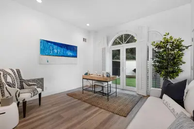 a living room with a table and a couch at Escondido Escape in Malibu