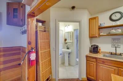 a kitchen with a sink and a bathroom at 1 Mi to Lake Home with Hot Tub and Gazebo in Big Bear in Big Bear Lake