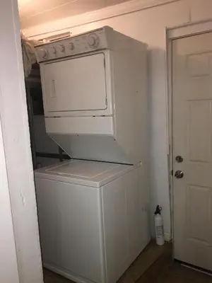 a white washer and dryer in a room at DTLA Oasis Private Bedroom with Exclusive Laundry - Steps to the Heartbeat of LA in Los Angeles