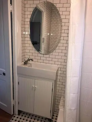 a bathroom with a sink and a mirror at Urban Oasis with Private Laundry: Steps from DTLA in Los Angeles