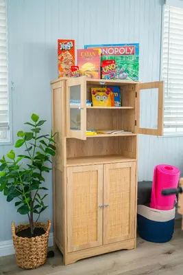 a wooden toy shelf in a room with a plant at Retreat Minutes To LAX, Manhattan/ Redondo Beach in Torrance