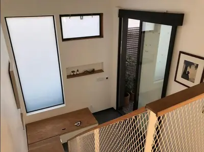 a balcony with two windows and a mirror at Dogtown Loft in Los Angeles