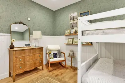 a bedroom with a bunk bed and a mirror at Pine Meadow Village Castle~ Incredible Chalet Home in Big Bear Lake