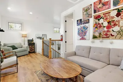 a living room with a couch and a table at Pine Meadow Village Castle~ Incredible Chalet Home in Big Bear Lake