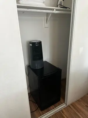 a small room with a desk in a closet at Buxton Room in Rialto
