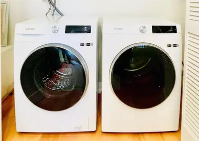 two washing machines are sitting next to each other at 2 BR 2 BA - Eco House and Garden Vacation Retreat and Remote Workspace for Families, Couples and Solo Travelers in Coveted Culver in Culver City