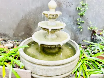 a water fountain in a garden with plants at 2 BR 2 BA - Eco House and Garden Vacation Retreat and Remote Workspace for Families, Couples and Solo Travelers in Coveted Culver in Culver City