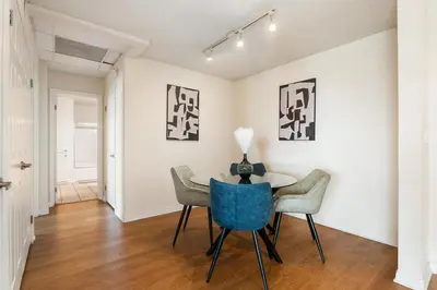 a dining room with a table and chairs in a room at Amber Tide - Bright 1BR Marina Gem Ocean View in Los Angeles