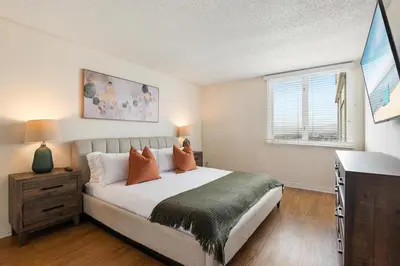 a bedroom with a large bed and a window at Amber Tide - Bright 1BR Marina Gem Ocean View in Los Angeles