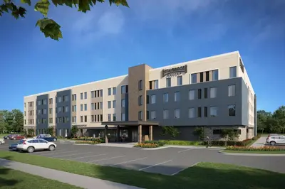 a rendering of a building with a parking lot at Staybridge Suites Eastvale - Norco by IHG in Eastvale