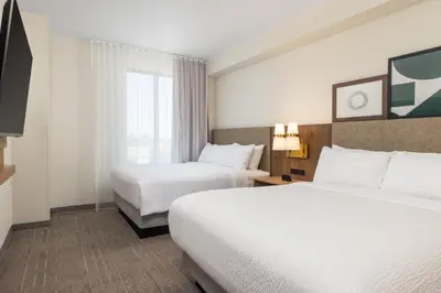 a hotel room with two beds and a window at Staybridge Suites Eastvale - Norco by IHG in Eastvale