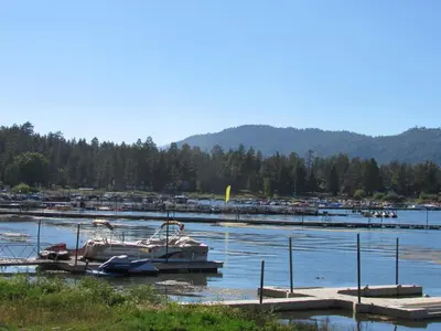 a group of boats docked at a dock in a marina at Smith Lakefront Hideaway in Big Bear Lake