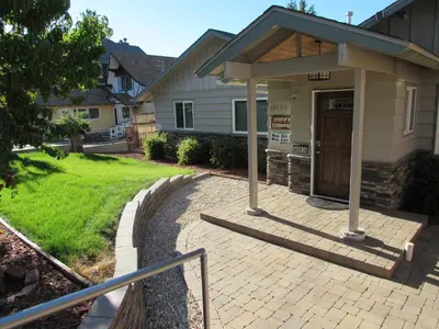 a building with a ticket booth in front of a house at Smith Lakefront Hideaway in Big Bear Lake
