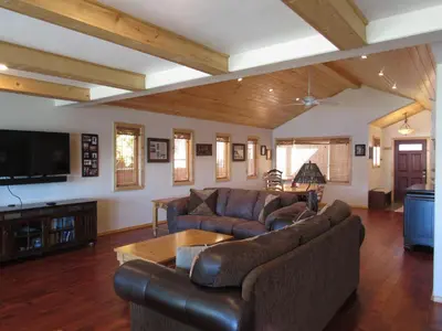 a living room with two couches and a tv at Smith Lakefront Hideaway in Big Bear Lake