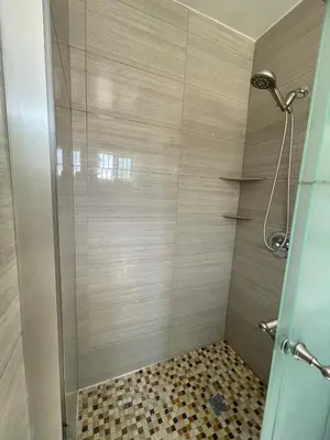 a shower with a glass door in a bathroom at Your home away from home in beautiful Santa Monica in Los Angeles