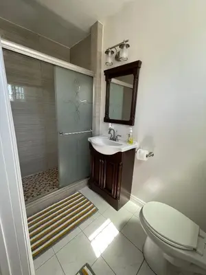 a bathroom with a shower and a sink and a toilet at Your home away from home in beautiful Santa Monica in Los Angeles
