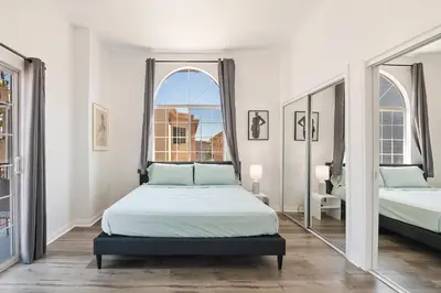 a bedroom with two beds and a large mirror at Spacious Private gated modern loft close to Universal Studio and Hollywood in Los Angeles