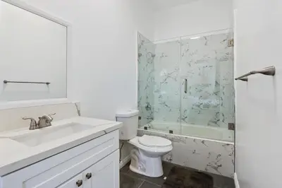 a bathroom with a sink and a toilet and a shower at Spacious Private gated modern loft close to Universal Studio and Hollywood in Los Angeles